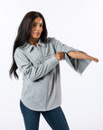 Celia wearing Stone Felt Shacket, showing arm zippers