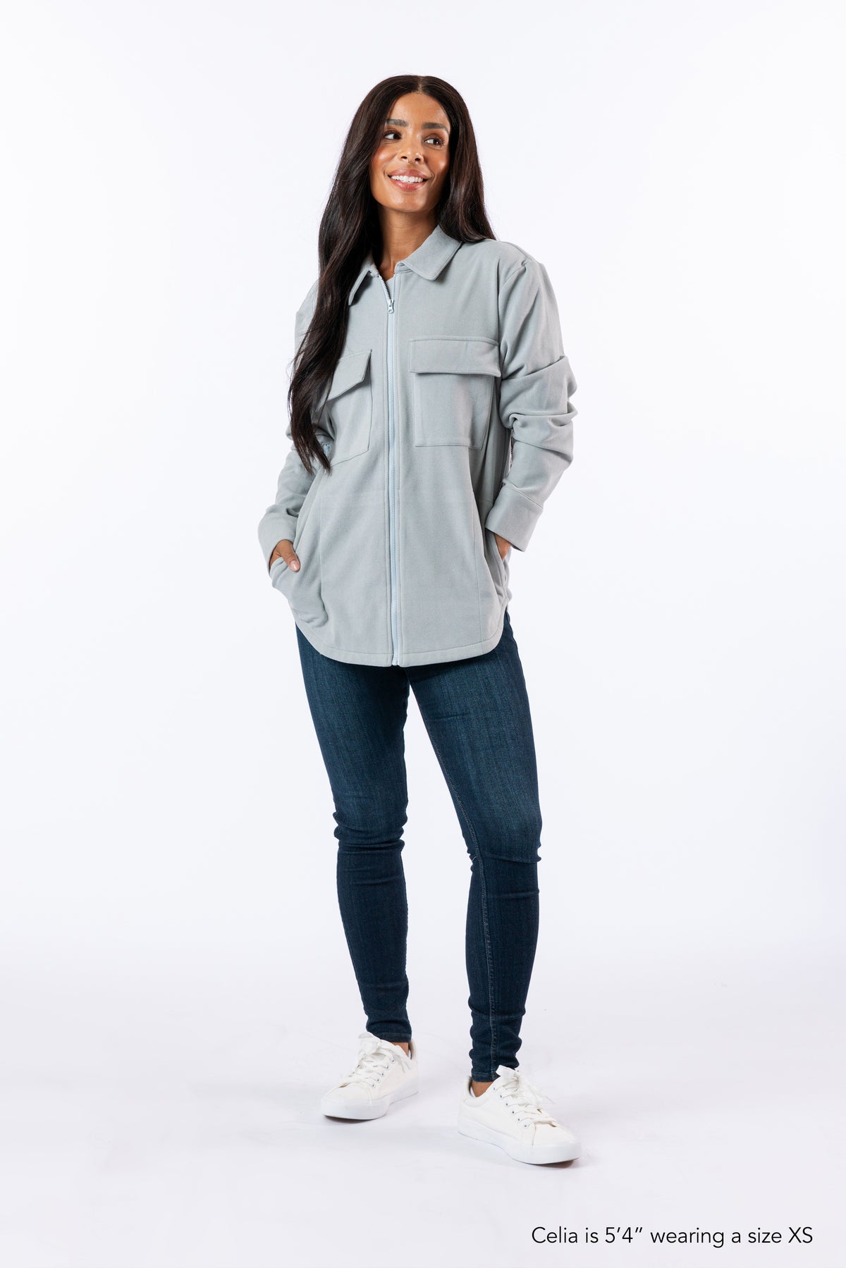 Woman wearing Full Zip Shacket zipped up. Text reads "Celia is 5'4" wewaring a size XS".