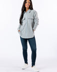 Woman wearing Full Zip Shacket zipped up. Text reads "Celia is 5'4" wewaring a size XS".