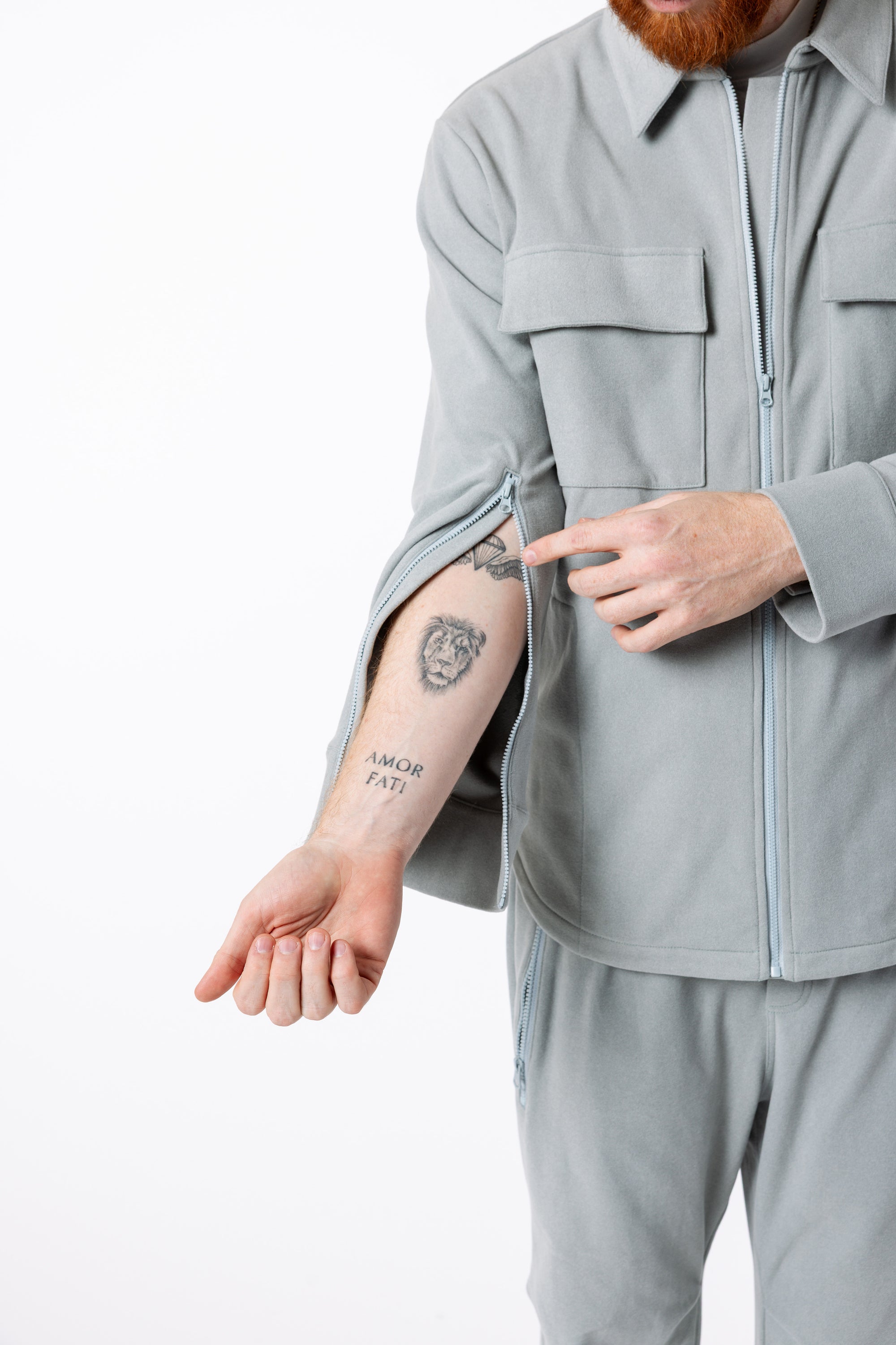 Mike showing open arm sleeve zippers