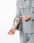 Mike showing open arm sleeve zippers