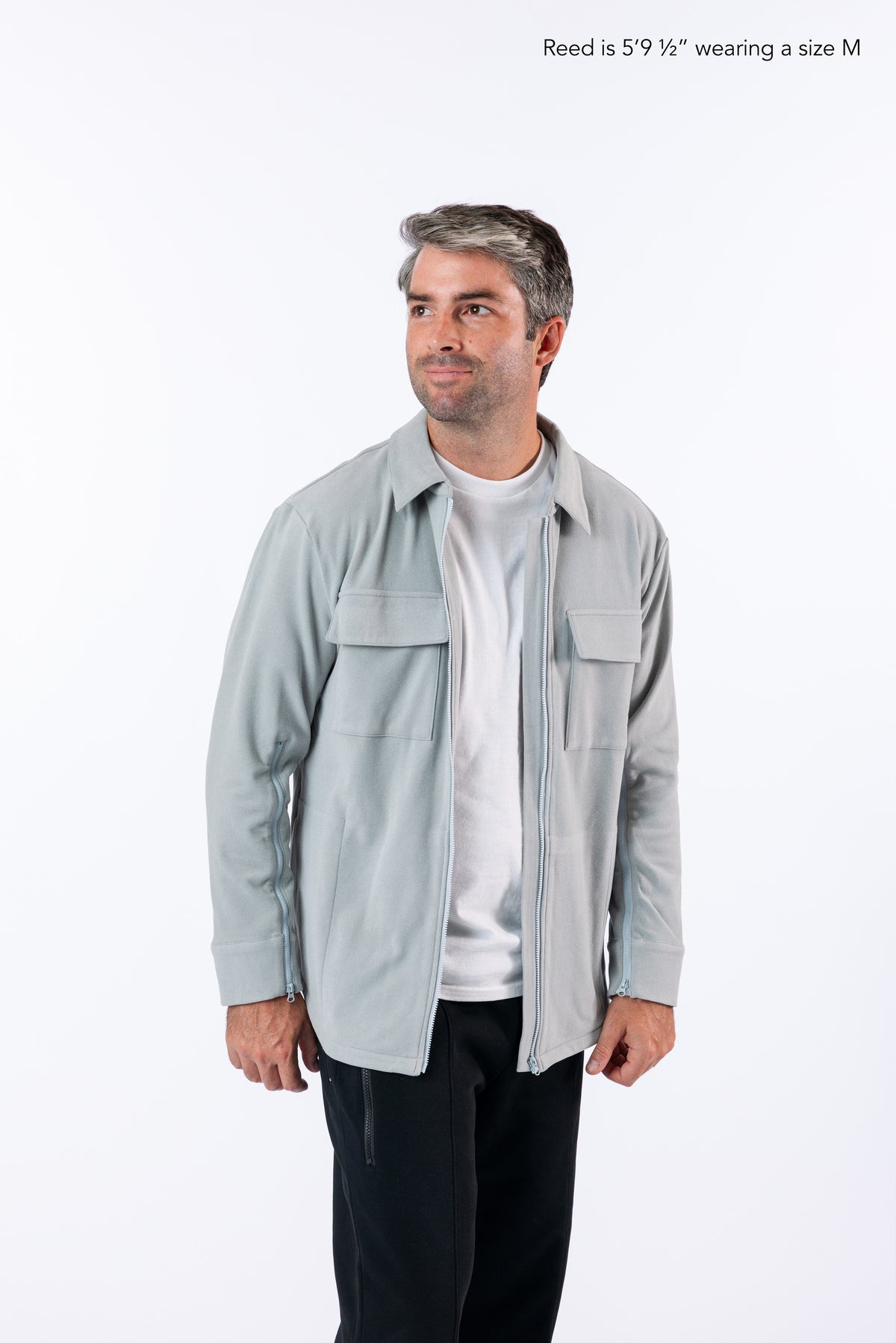 Reed is 5'9 1/2" wearing a size M Stone Zip Shacket