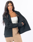 Woman showing interior pocket of Black Full Zip Hoodie