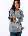 Model showing open arm zipper on gray Full Zipper Hoodie