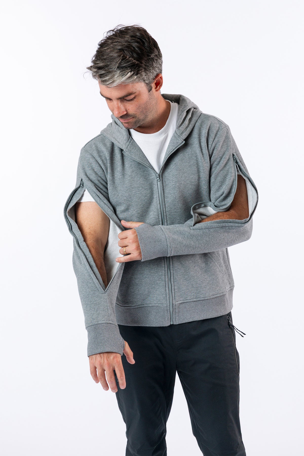 Man showing both open arm zippers on both sides of Full Zip Hoodie