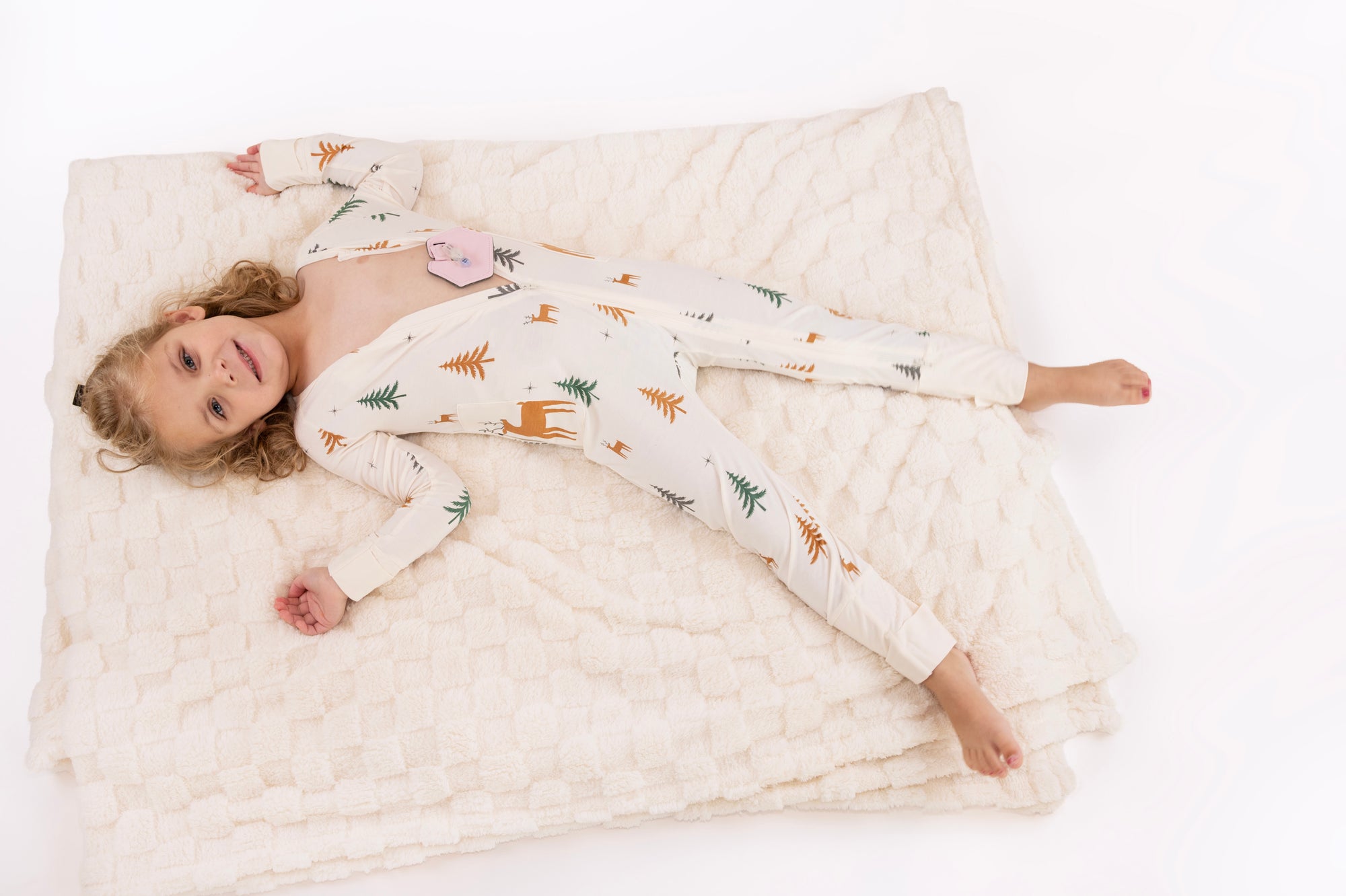 Child in Thru the Trees G-Tube Pajamas with G-Tube Pad