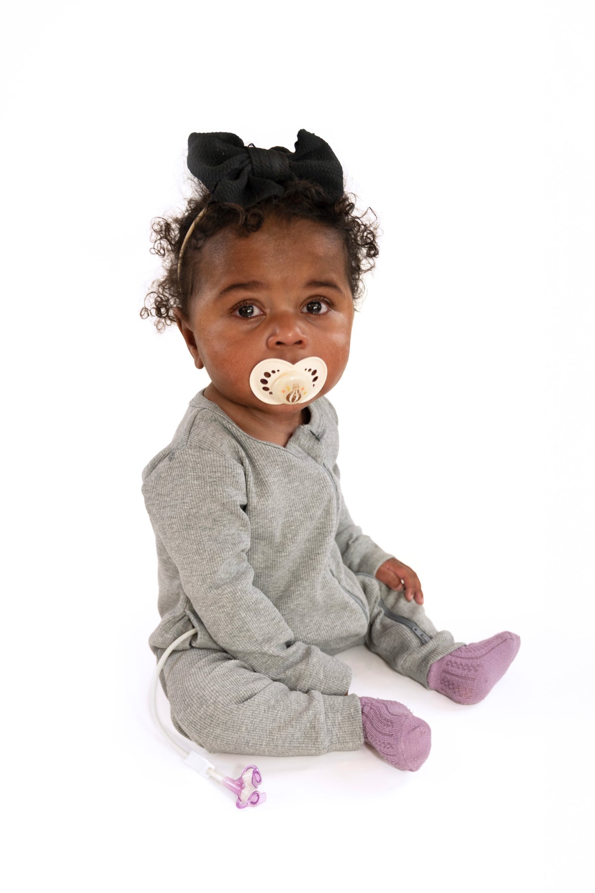 Baby in open Heather Gray Rib G-Tube Pajamas with G-Tube showing