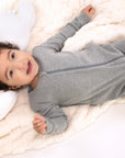 Child wearing Heather Gray Rib G-Tube Pajamas lying down