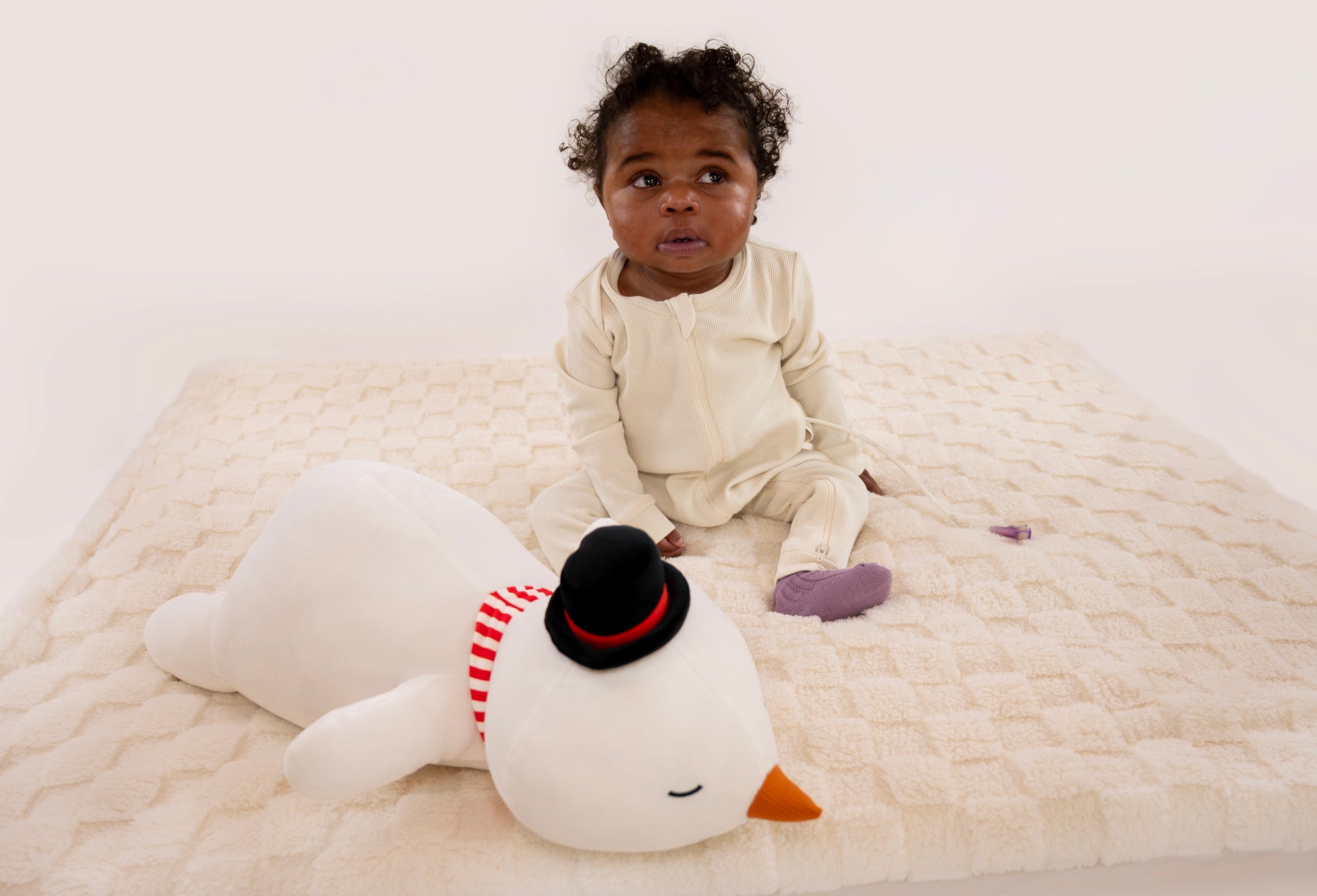 Baby sitting wearing Vintage White Rib G-Tube Pajamas