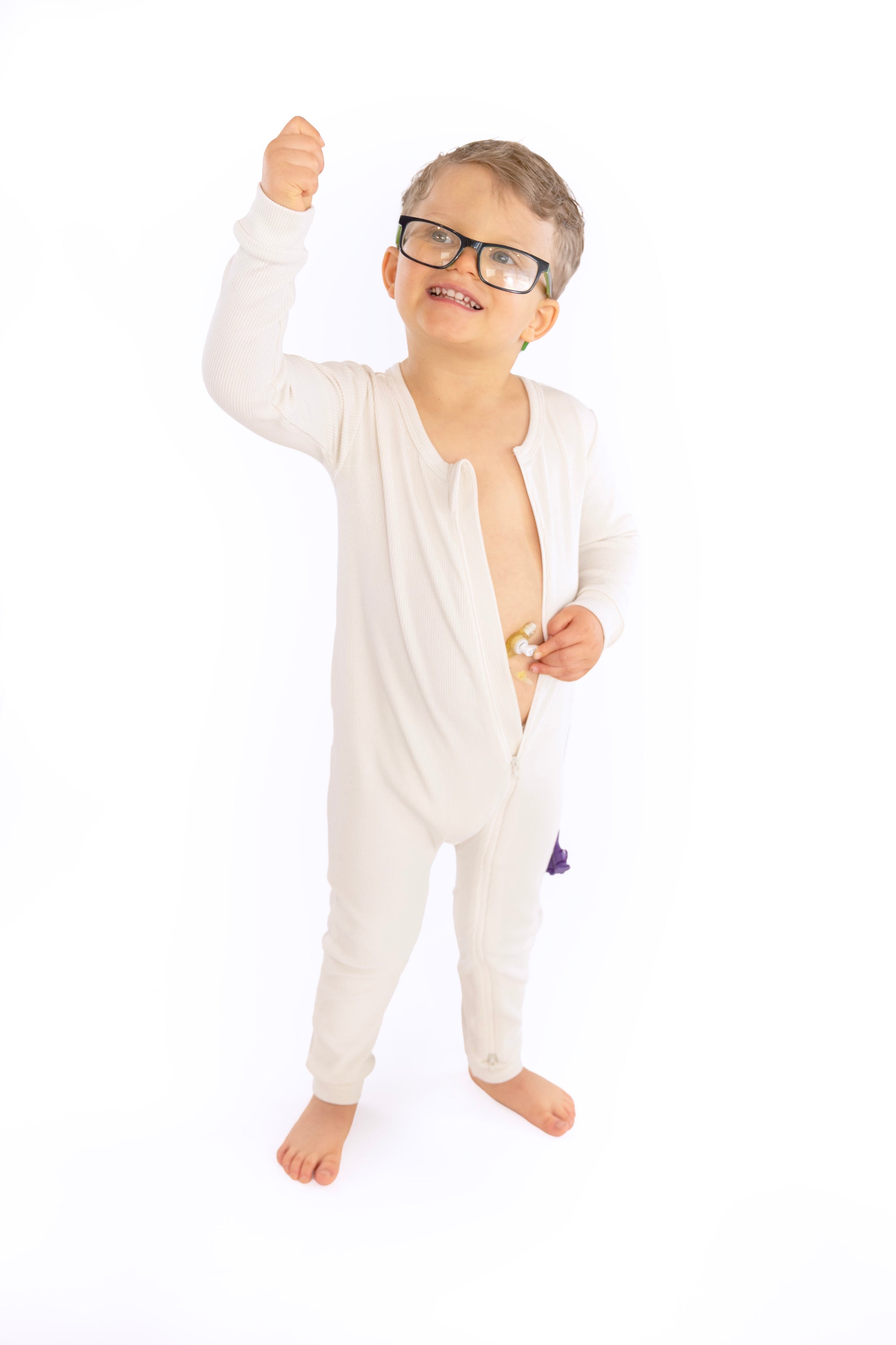 Child wearing open Vintage White Rib G-Tube Pajamas with g-tube