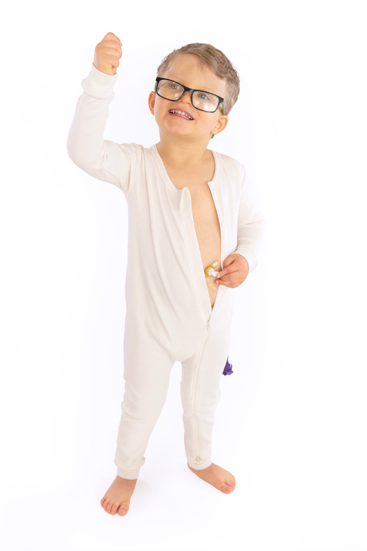 Child wearing open Vintage White Rib G-Tube Pajamas with g-tube