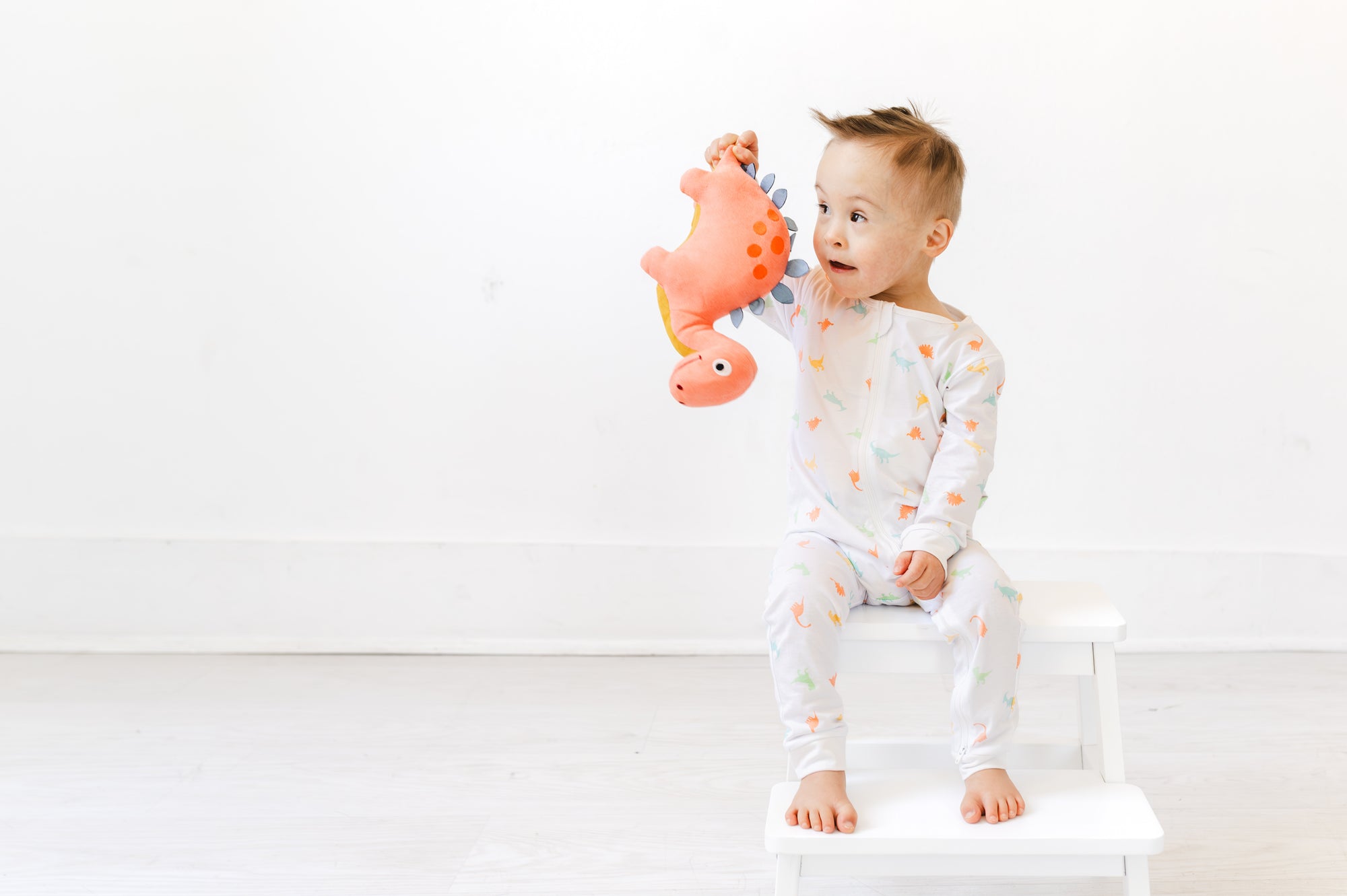 Boy in Dino G-Tube Pajamas