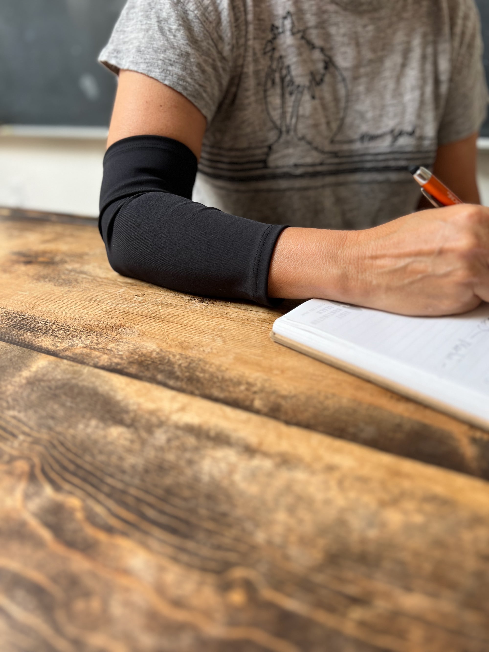 Woman wearing black Support Sleeve