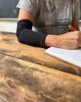 Woman wearing black Support Sleeve