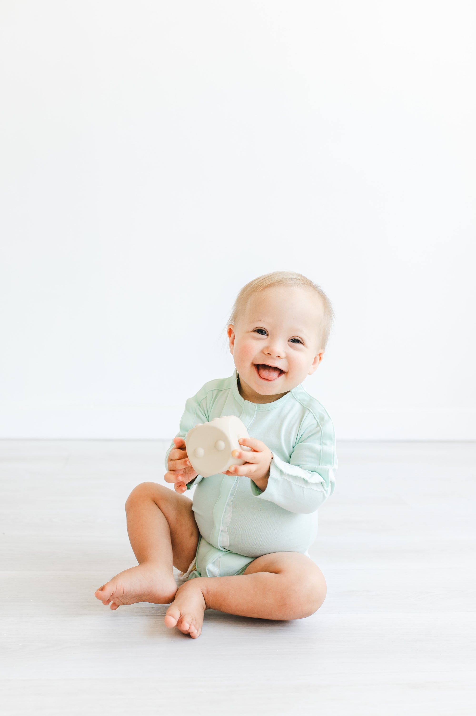 Boy wearing longsleeve mint all access bodysuit