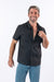 Male model showcasing magnetic buttons on shirt