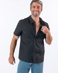 Male model showcasing magnetic buttons on shirt