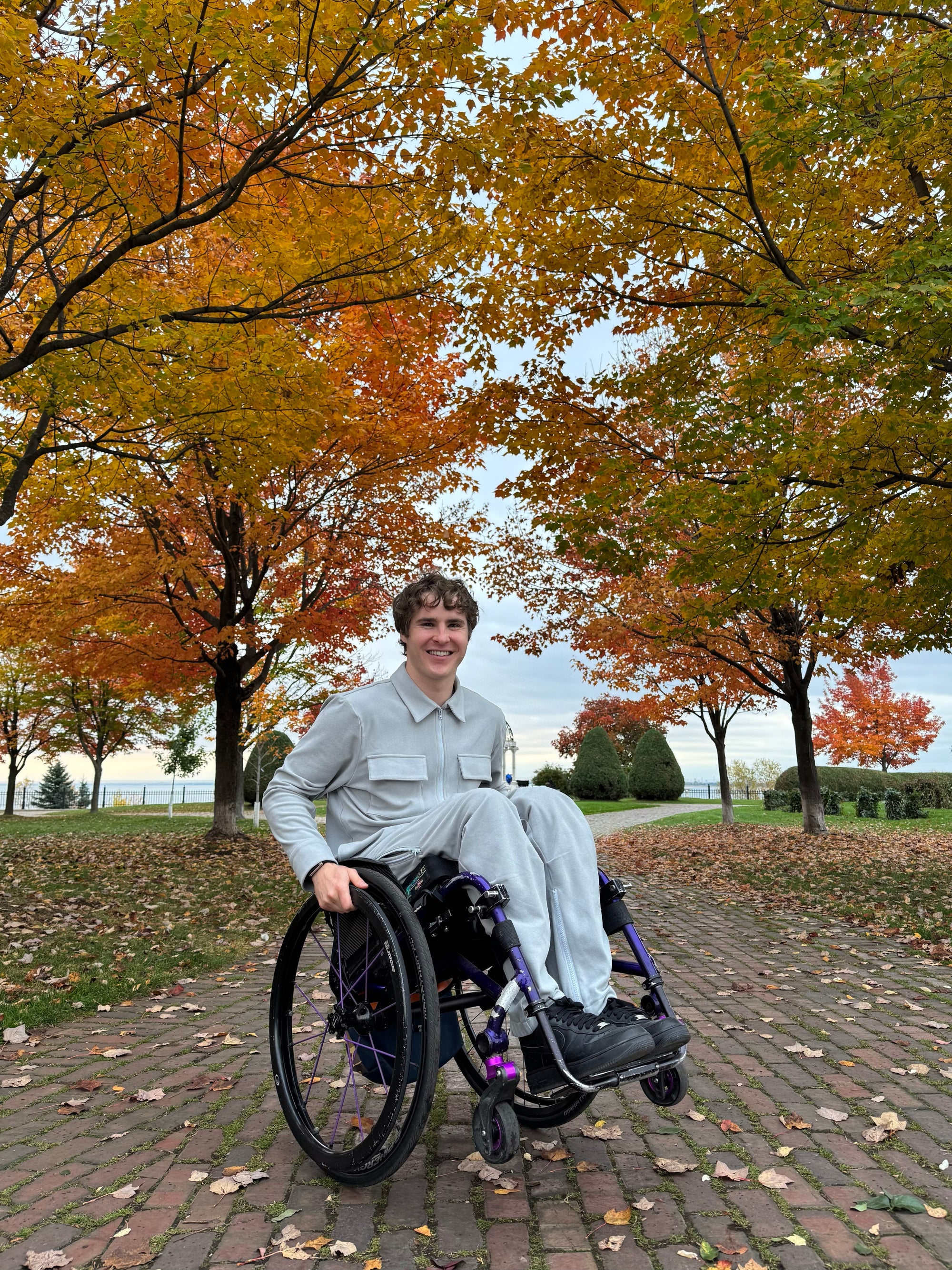 Mason Branstrator wearing Stone Felt Zip Access Shacket and Stone Felt Zip Access Pant in wheelchair