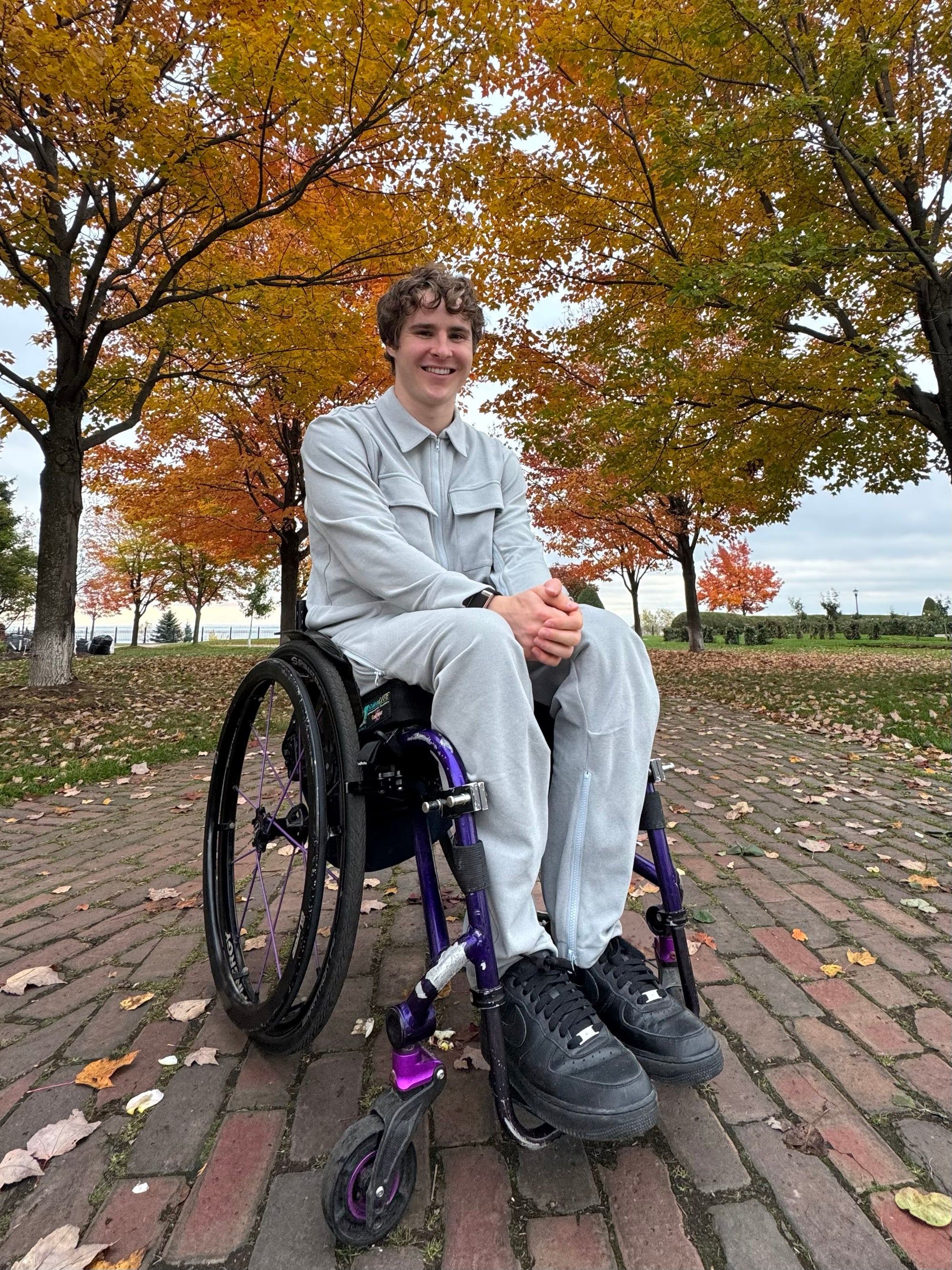 Mason Branstrator wearing Stone Felt Zip Access Shacket and Stone Felt Zip Access Pant in wheelchair