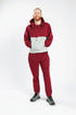 Man wearing Crimson Colorblock Hoodie and Fleece Zip Pants