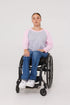 Woman in wheelchair wearing pink Adult Raglan Chemo Port Access Tee Shirt
