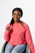 Denisha posing with open chest zipper