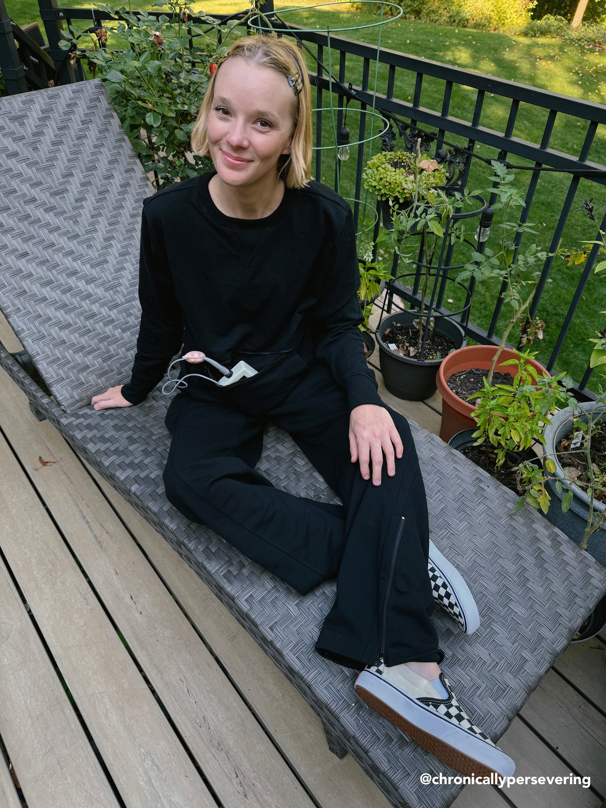 Cienna Ditri @chronicallypersevering in Zip Access Crew Sweatshirt, showcasing device storage 
