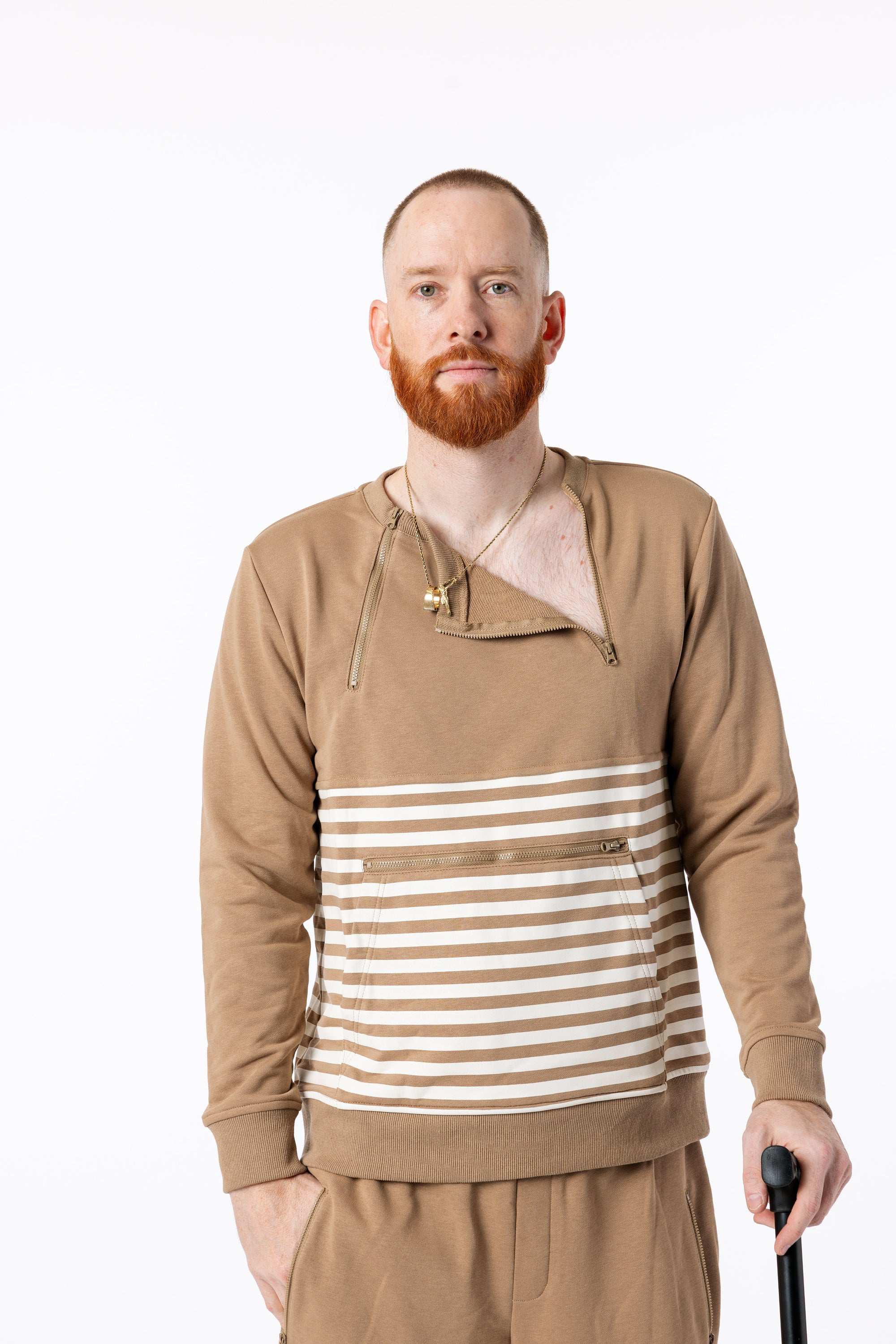 Mike showcasing chest zippers on Stripe Zip Access Sweatshirt
