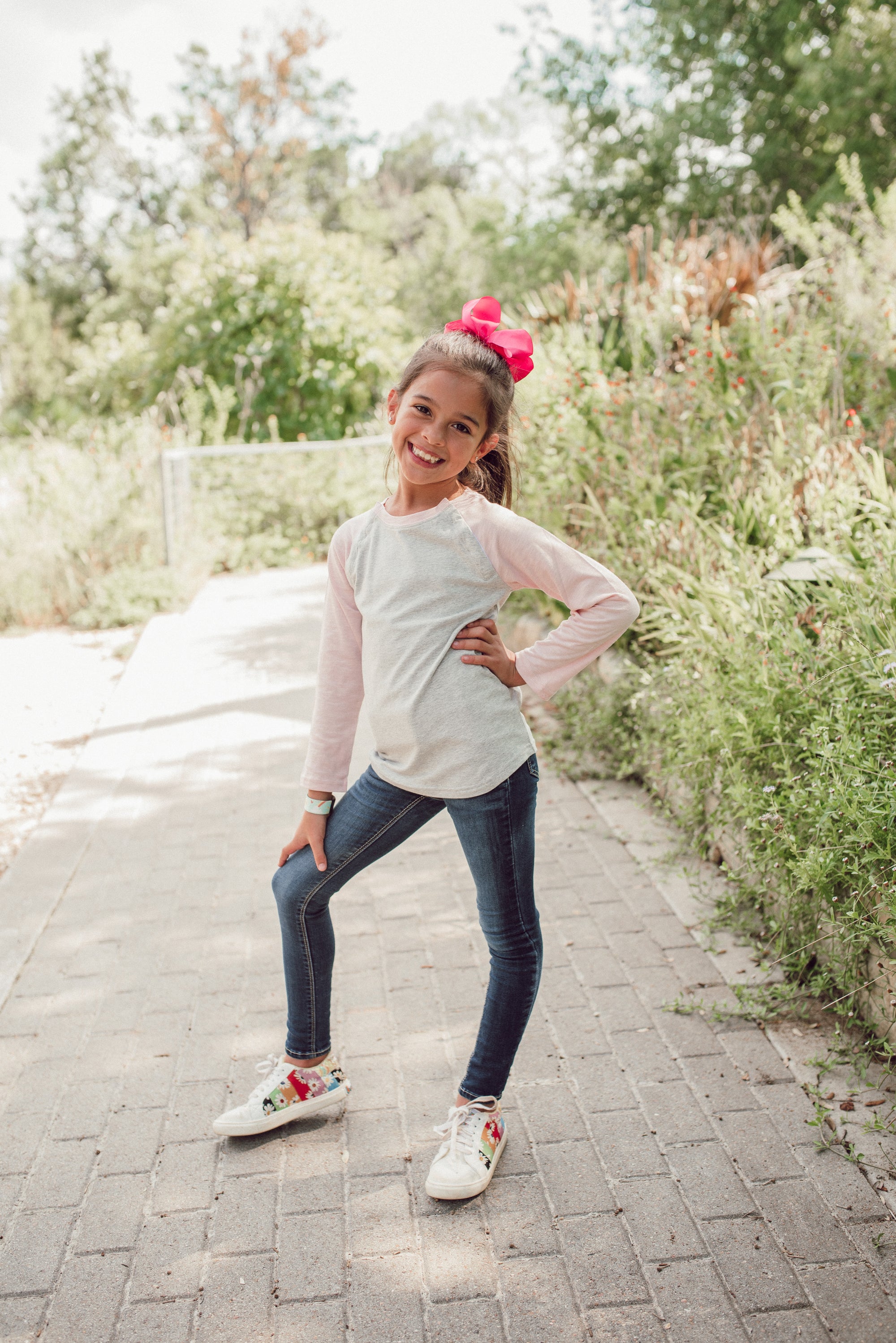 Girl wearing pink Kids Raglan Access Tee