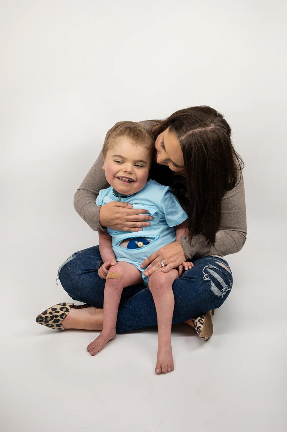 Boy in blue Tummy Access Bodysuit with G-Tube Pad