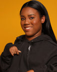 Woman wearing black Zipper Access Hoodie with open zipper