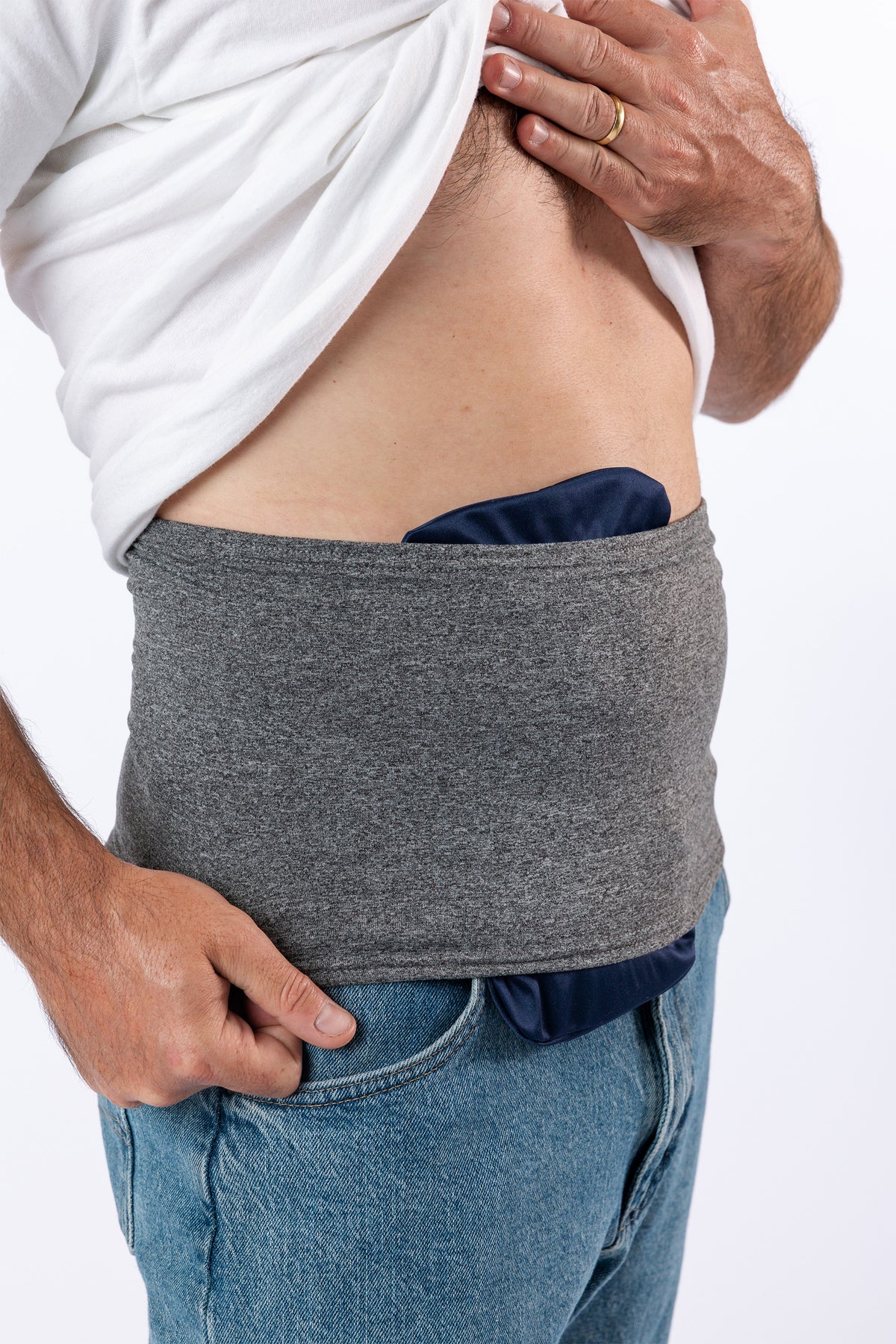 Closeup of Steel stretch waistband covering navy ostomy bag cover