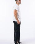 Male model showing open ankle zipper. Text reads "Reed is 5'9 1/2" wearing a size M".