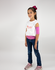 Girl standing wearing hot pink insulin pump belt