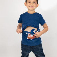 Boy wearing royal blue firetruck G-tube zip shirt with zipper for abdominal access open to show g-tube pad