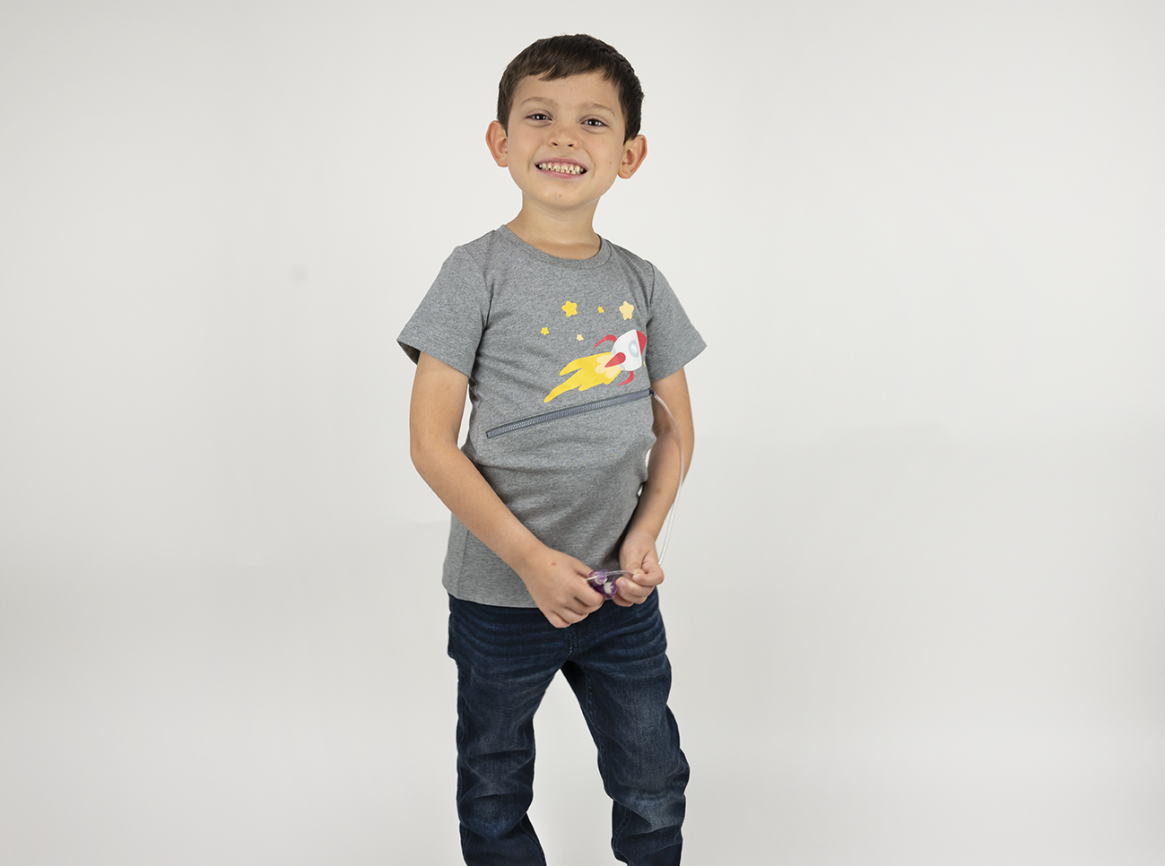 Boy wearing Gray Spaceship G-tube zip shirt with zipper for abdominal access