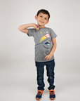 Boy standing Gray Spaceship G-tube zip shirt with zipper for abdominal access open to show g-tube pad